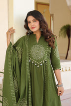 Wine Anarkali bandhani suit – close-up portrait showing mandala mirror work chest embroidery and mirror tassels
