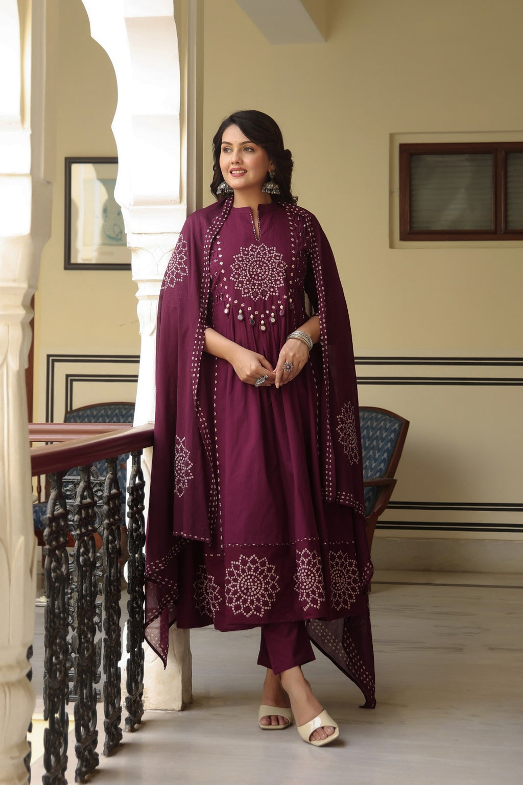 Wine Anarkali bandhani suit – full front standing view with dupatta held open showing mirror work border