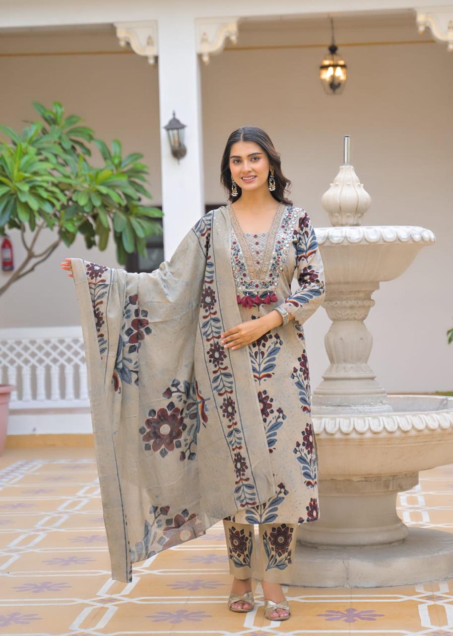 Beige blue ikat print suit – close-up hand embroidery red mirror work neckline