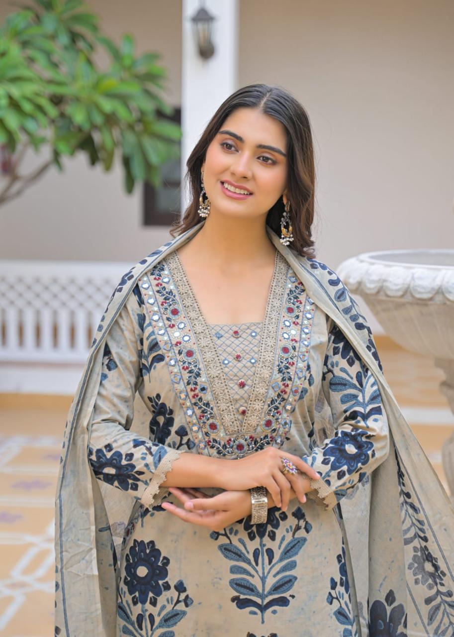Beige brown ikat print suit – dupatta drape standing pose by fountain
