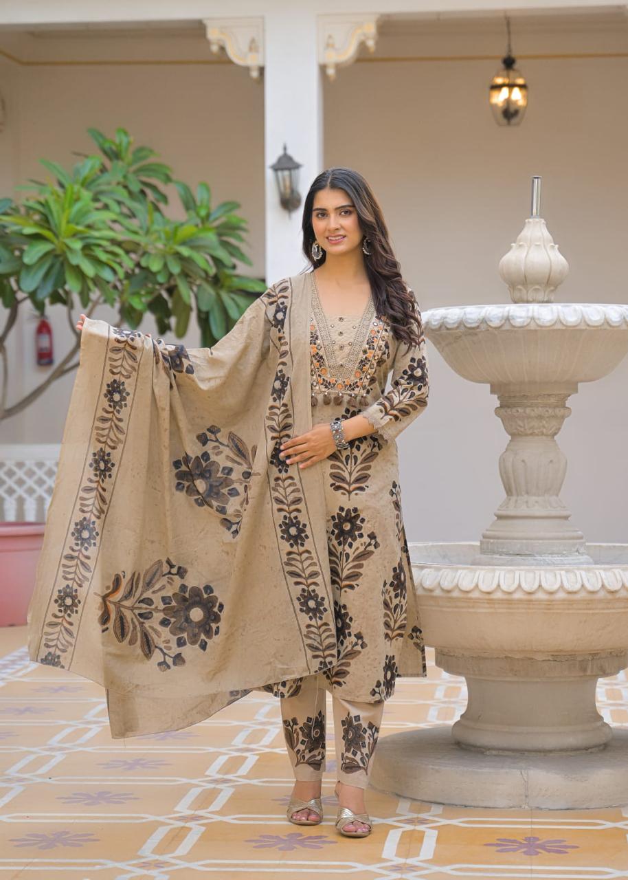 Beige Jaipuri ikat print suit – close-up hand embroidery mirror work neckline with silk tassels