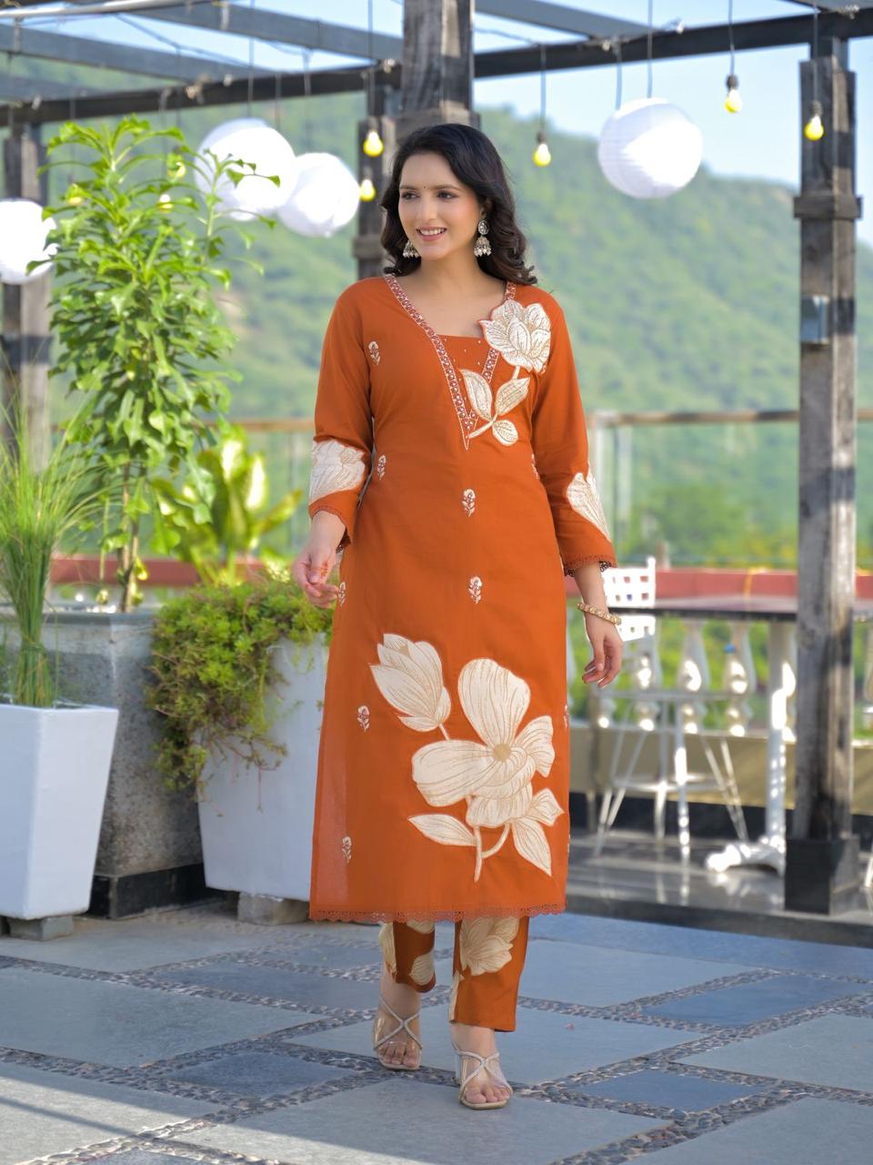 Black premium cotton suit with cream applique floral motif – walking pose with sheer dupatta