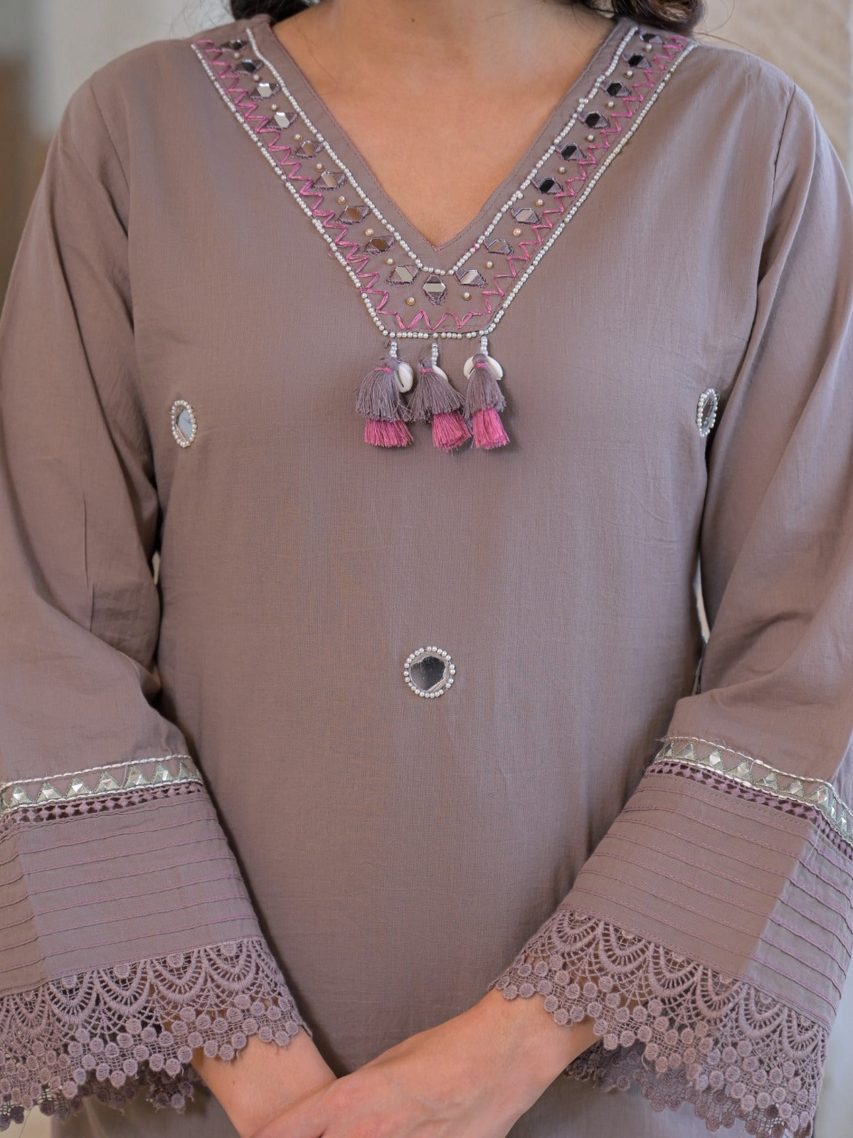 Grey taupe pure fabric suit – close-up large crescent paisley mirror motif on side with scalloped lace cuff